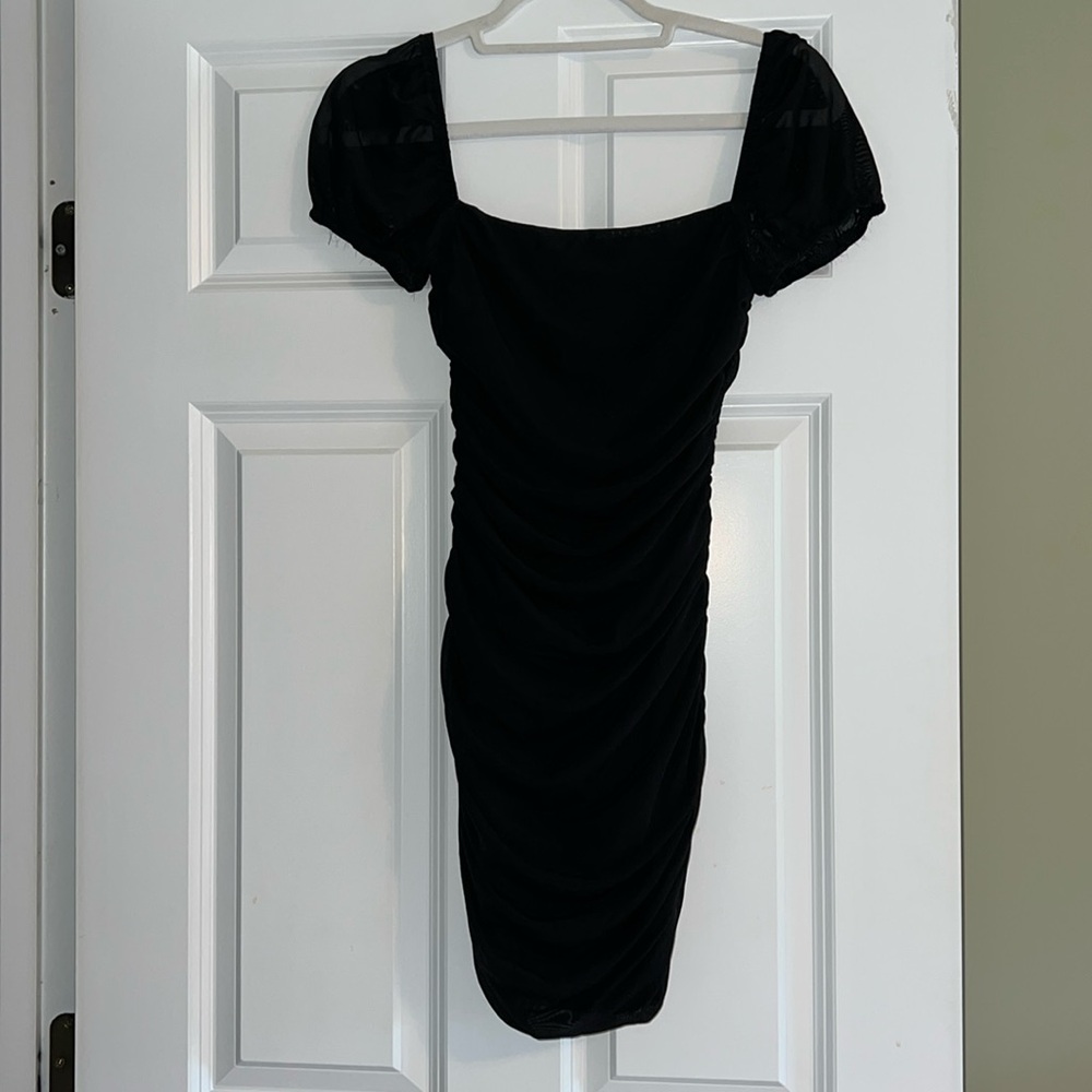Black mini dress,  ruched,  fully lined with mesh overlay,  sheer cap sleeves